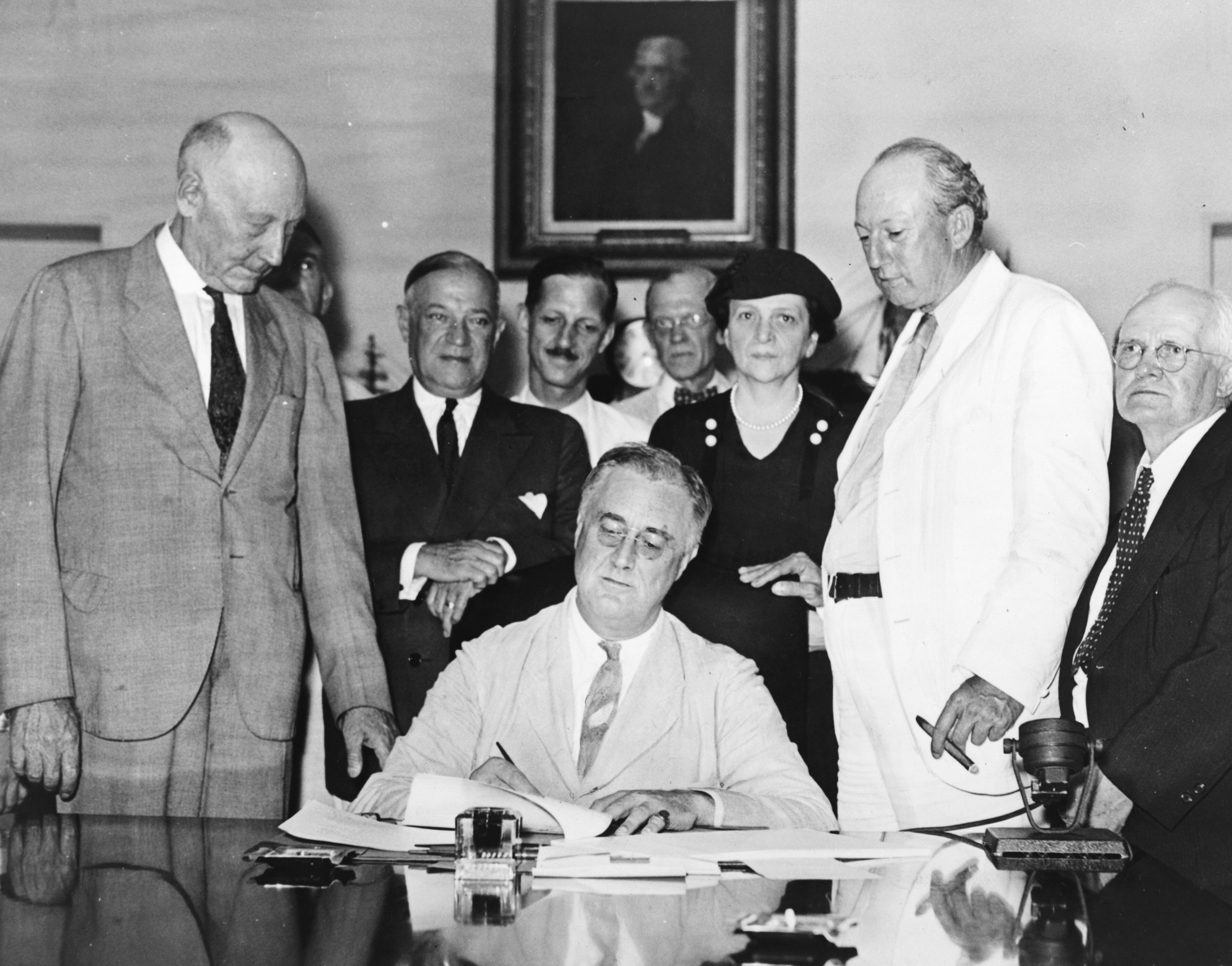 President Franklin Roosevelt signing the Social Security Act in 1935.